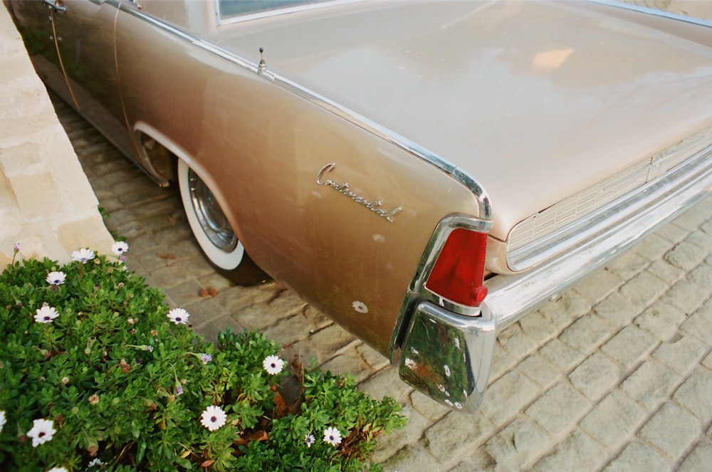 brown classic car on brown brick floor