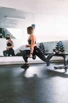 woman in black sports bra and black leggings doing exercise