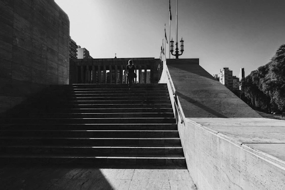 A warm image of a person climbing steps made of coins, symbolizing financial progress.