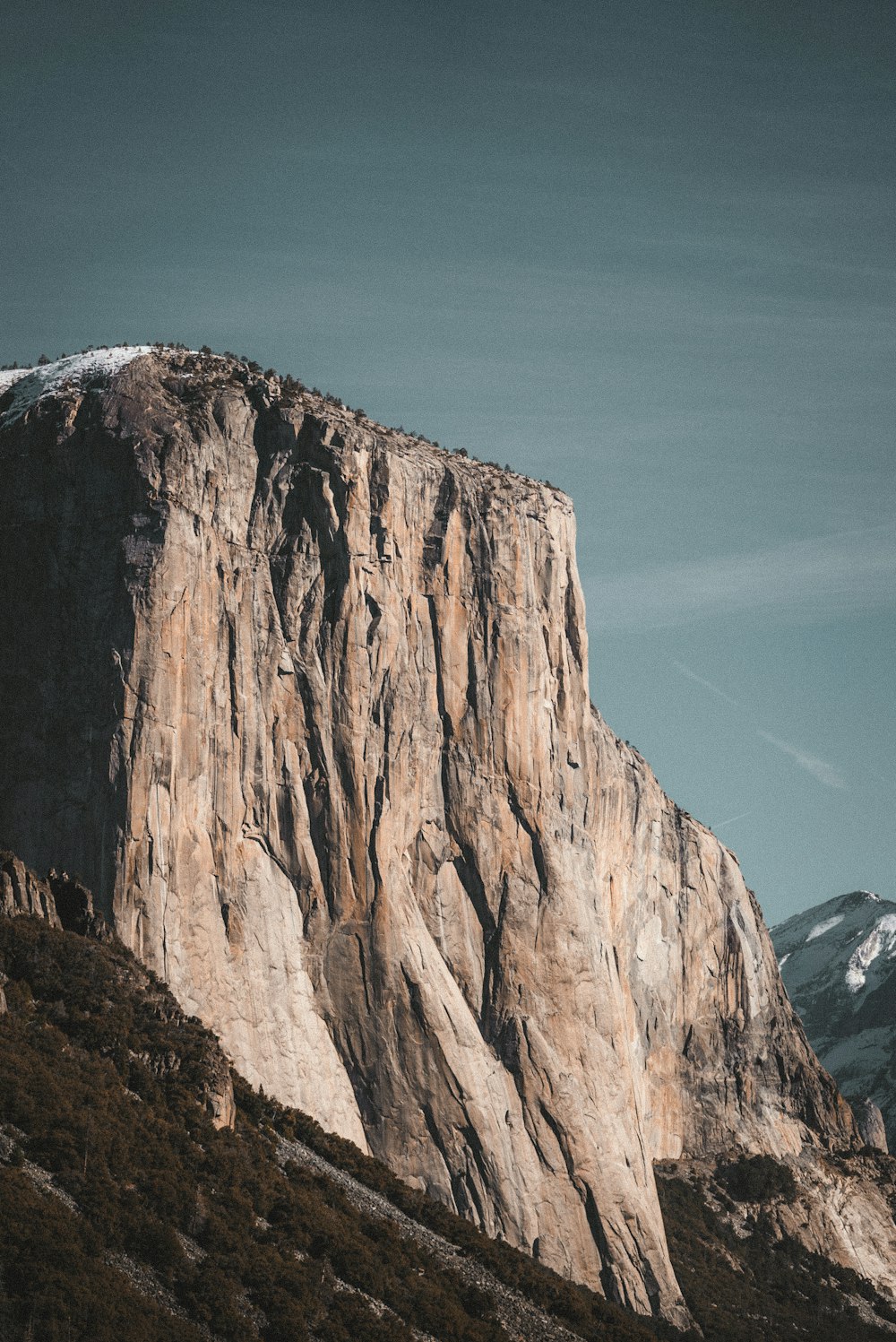 brown rocky mountain under blue sky during daytime