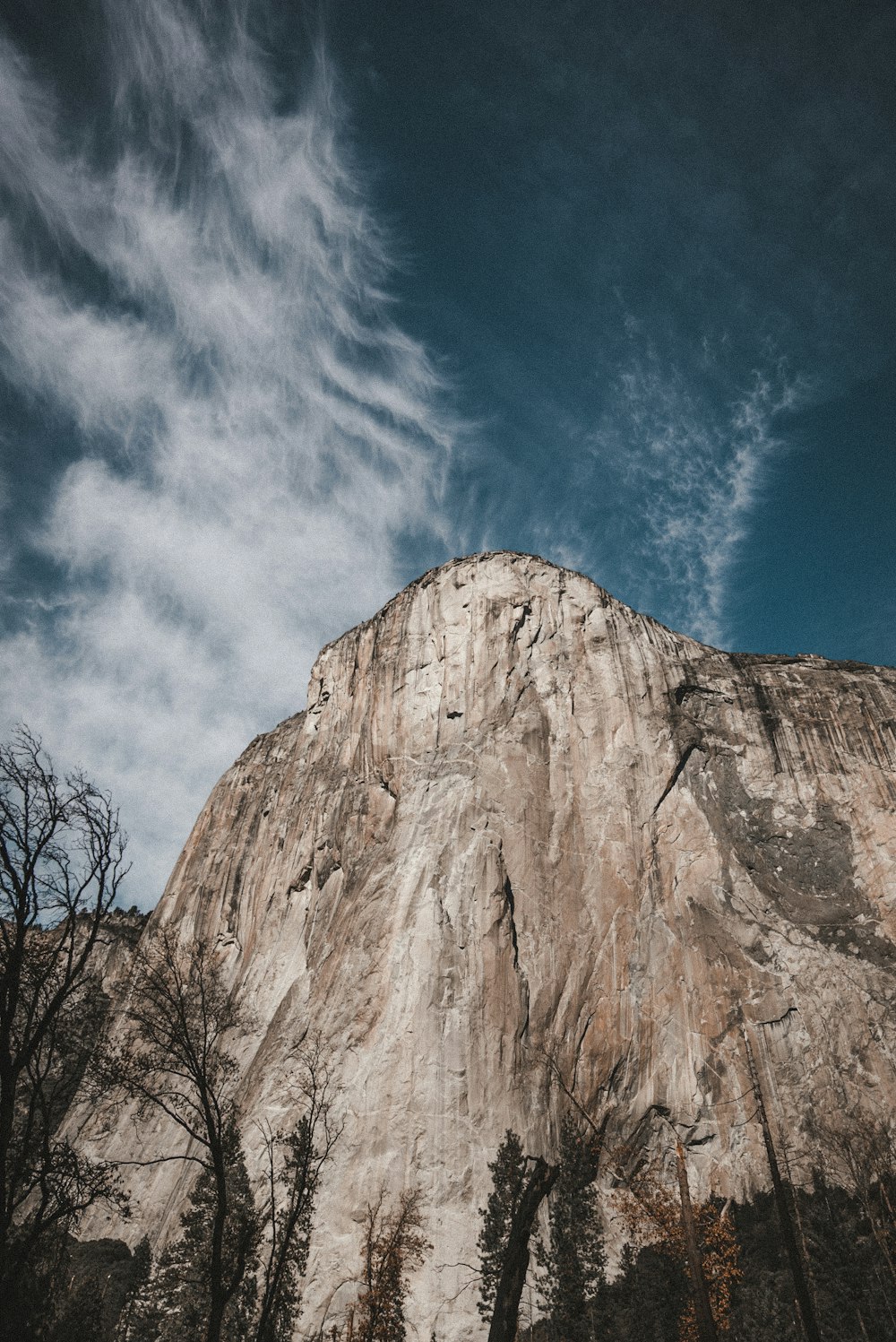 brown rocky mountain under blue sky during daytime