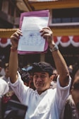 Close-up of a citizen signing an anti-corruption petition