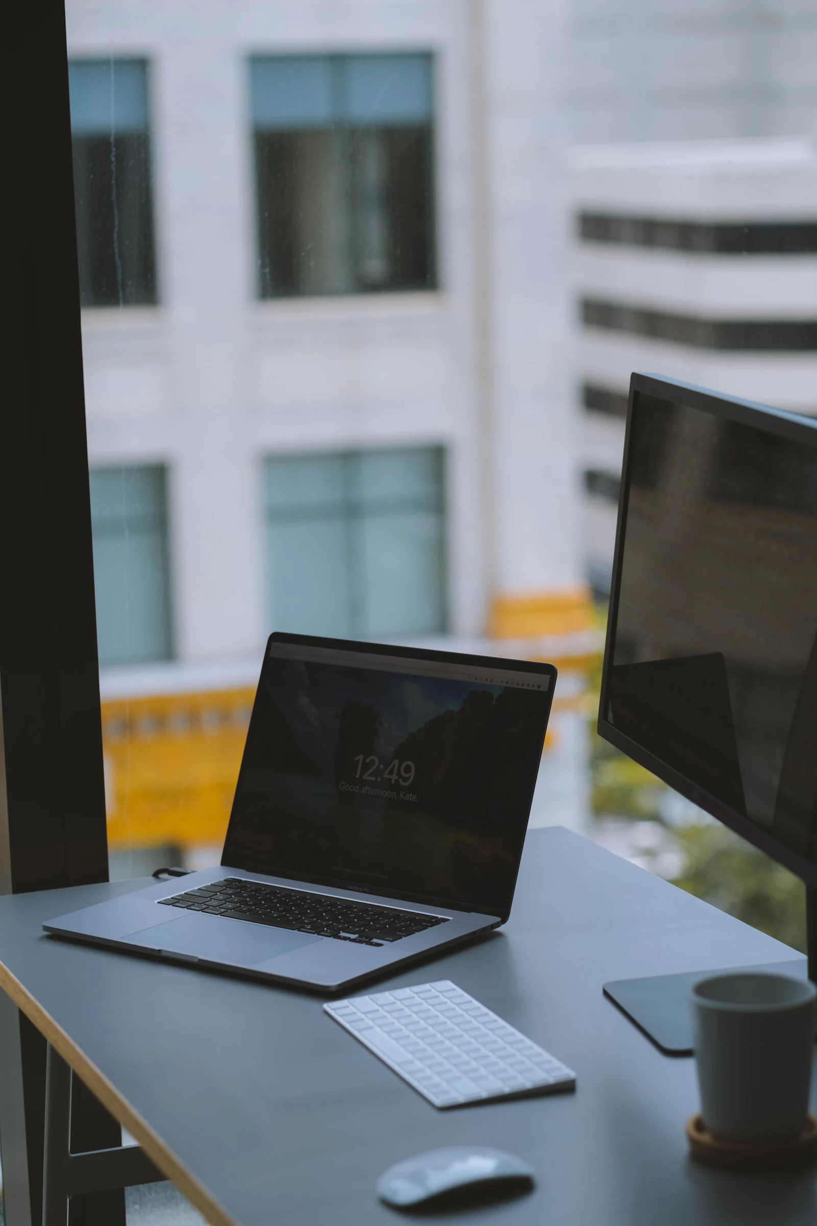 Clean modern MacBook laptop open on a tidy minimal white desk