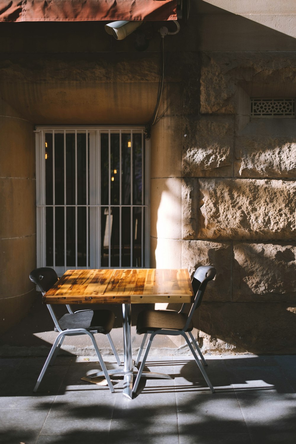 brown wooden table with chairs