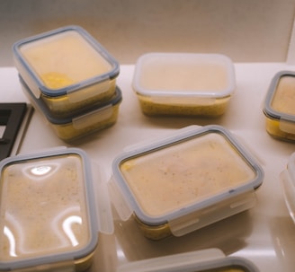 white plastic food container on white table