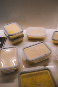white plastic food container on white table