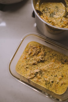 white plastic container with brown food