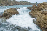 Seaside cliffs and waves crashing near the Algarve coastline