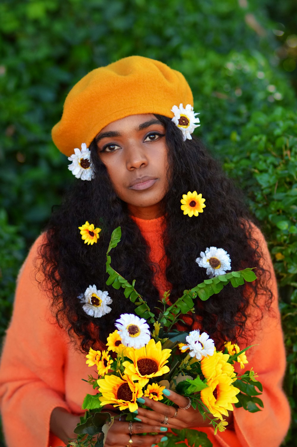 woman in orange sleeveless dress with yellow flower crown