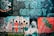 A vibrant mural on a brick wall features various elements, including an astronaut, intricate floral patterns, stylized buildings, and abstract human figures. The word 'COMMUNITY' is boldly painted with each letter representing a person. The phrase 'CREATE THE NIGHT' is illuminated in neon blue letters above the artwork. There's a tribute to a person named Ralph Anderson, signed 'Made of Stars'.