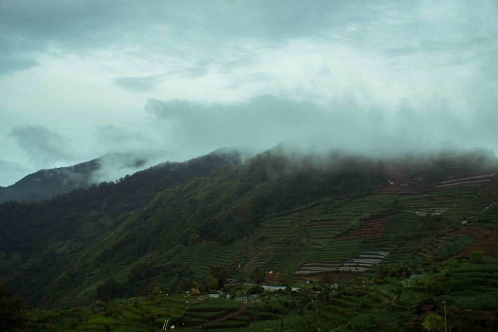 green mountains under white clouds during daytime