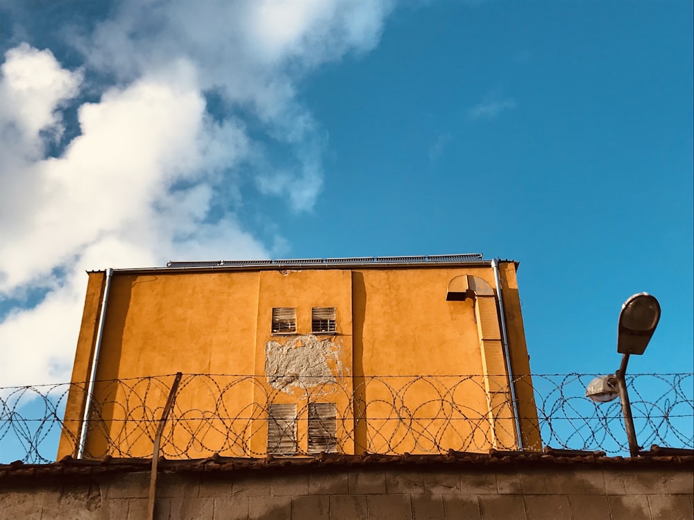 brown concrete building under blue sky