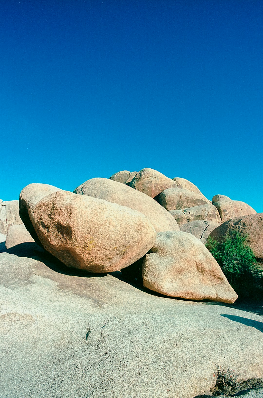 gray rock formation on white sand during daytime