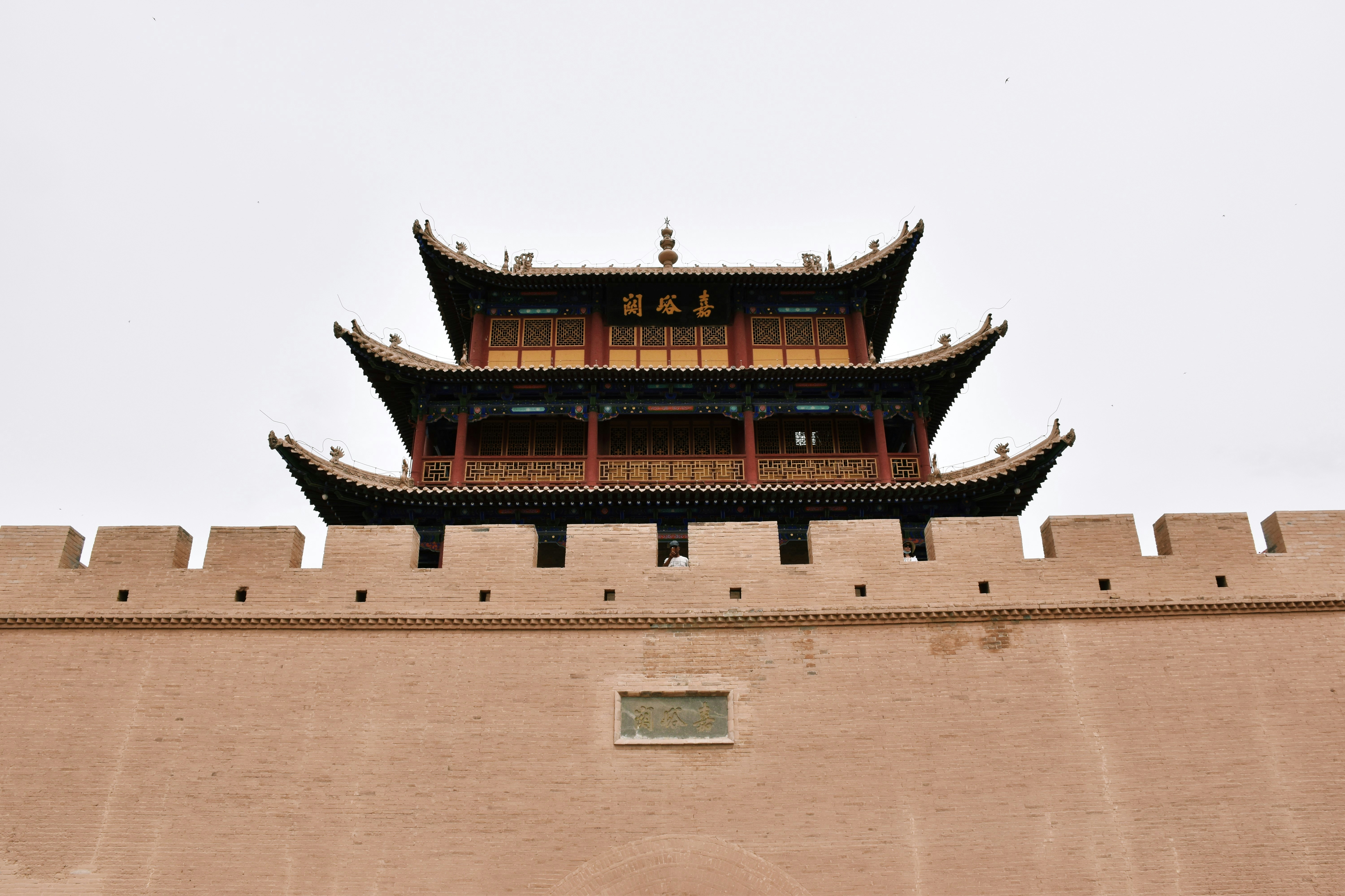 brown concrete building under white sky during daytime