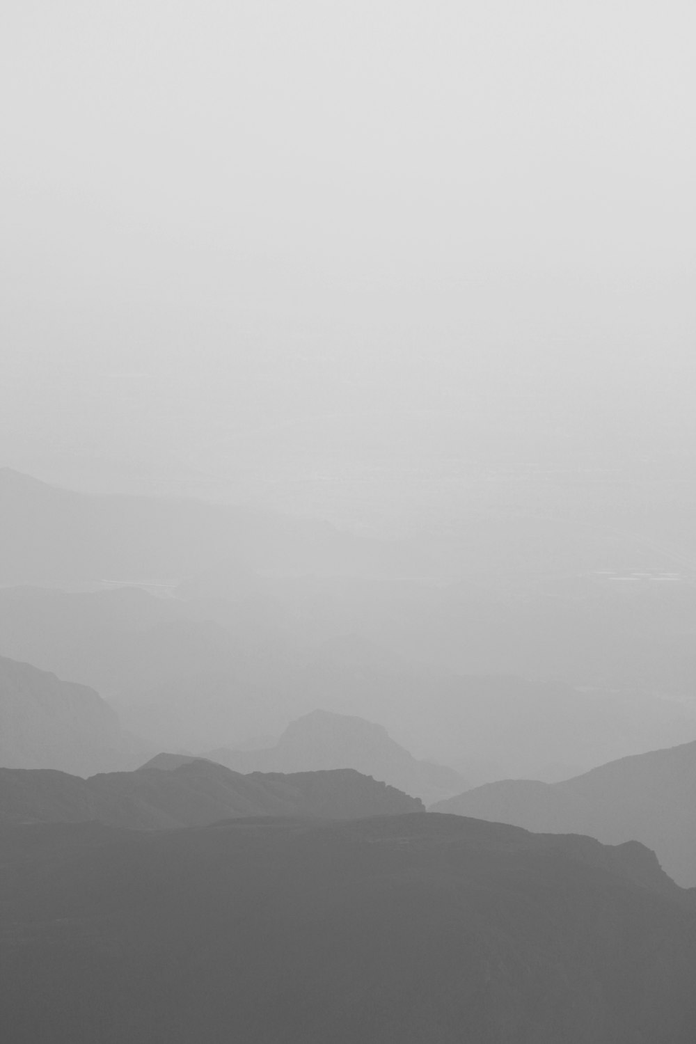 mountains under white sky during daytime