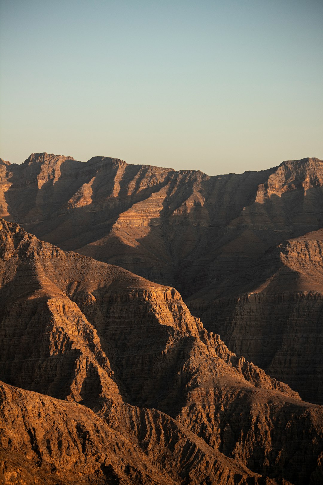 brown rocky mountain under blue sky during daytime