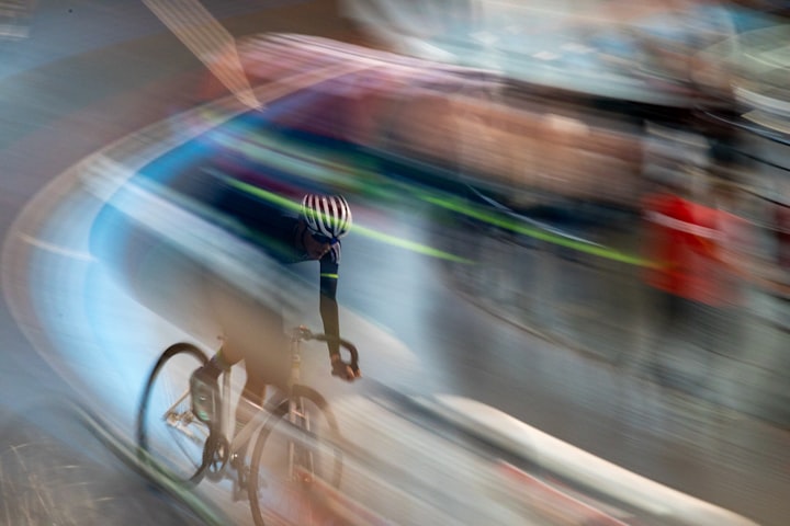 Blurred photo of a bike racer on a racetrack