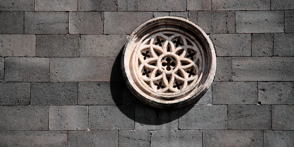 brown wooden round frame on gray concrete brick