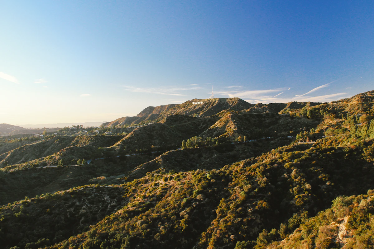 Green hills under a blue sky