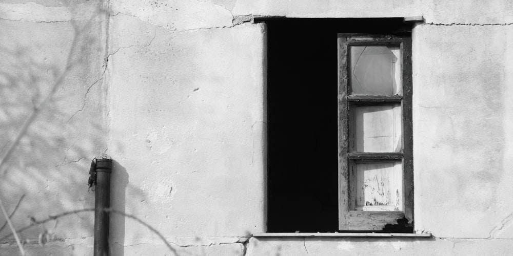 grayscale photo of window frame
