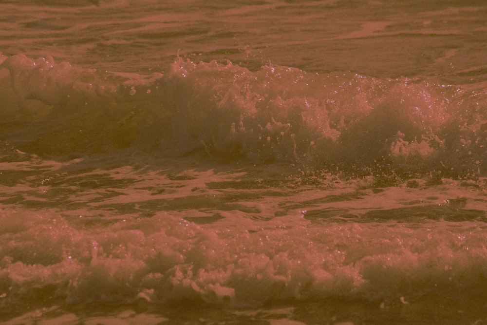 ocean waves crashing on shore during daytime