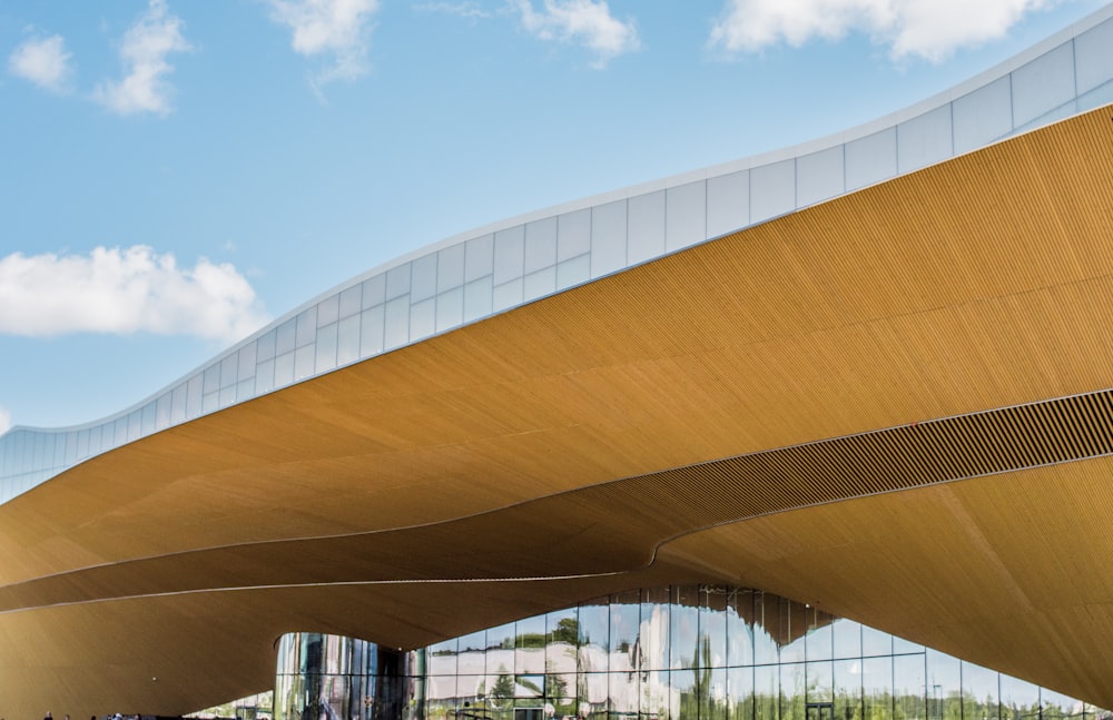 brown and white concrete building under blue sky during daytime