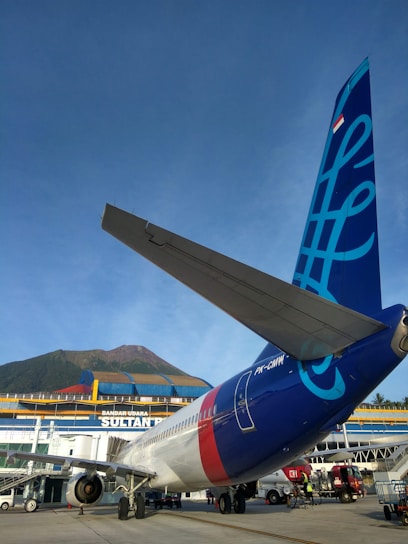 Friendly Batik Air customer service agent assisting a traveler over the phone.