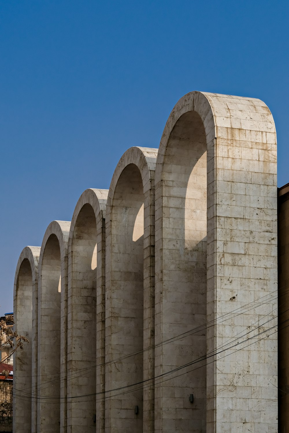 beige concrete building under blue sky during daytime