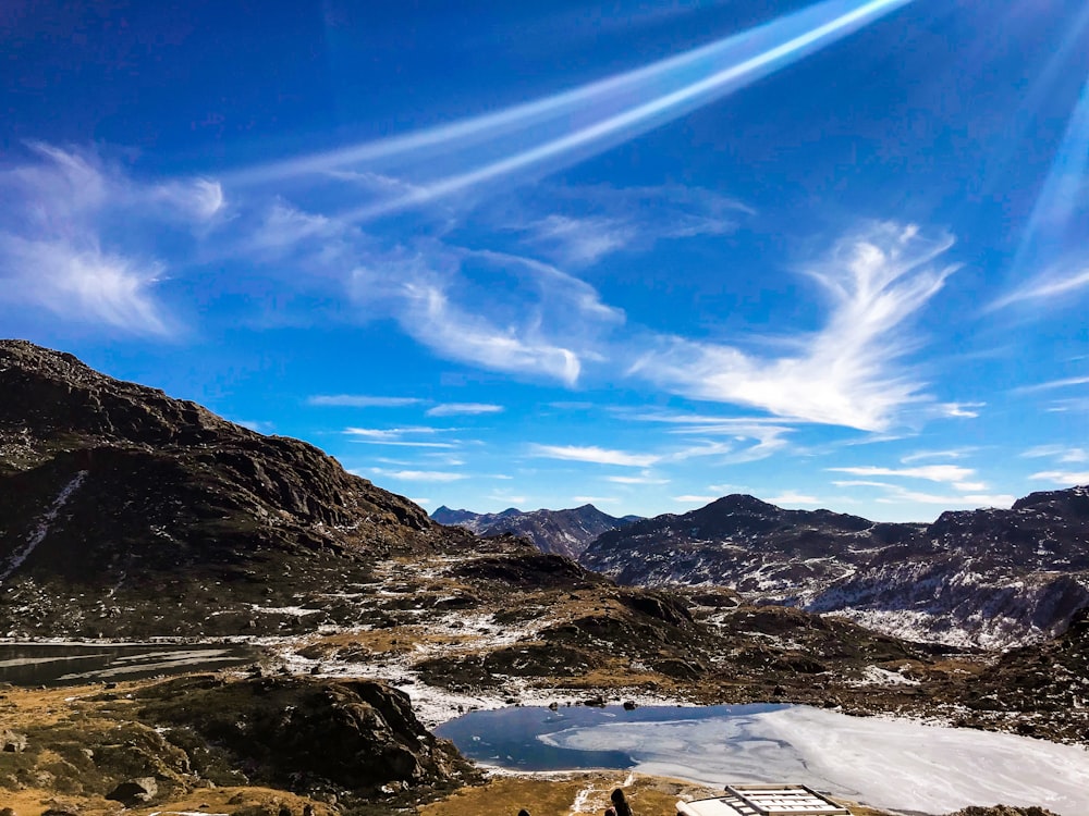 brown and white mountains under blue sky during daytime