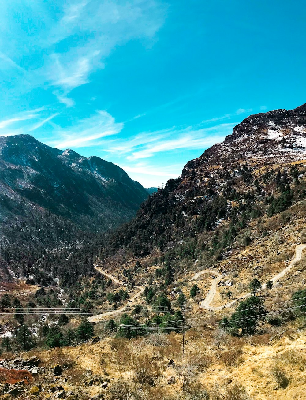 green and brown mountains under blue sky during daytime