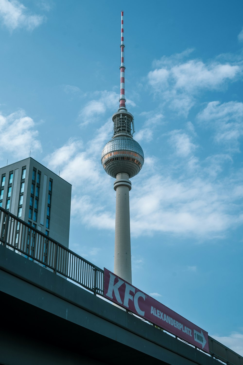 white and red tower under blue sky