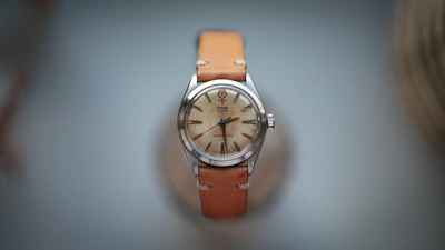 Side profile of a vintage Tissot watch showing its slim case and crown.