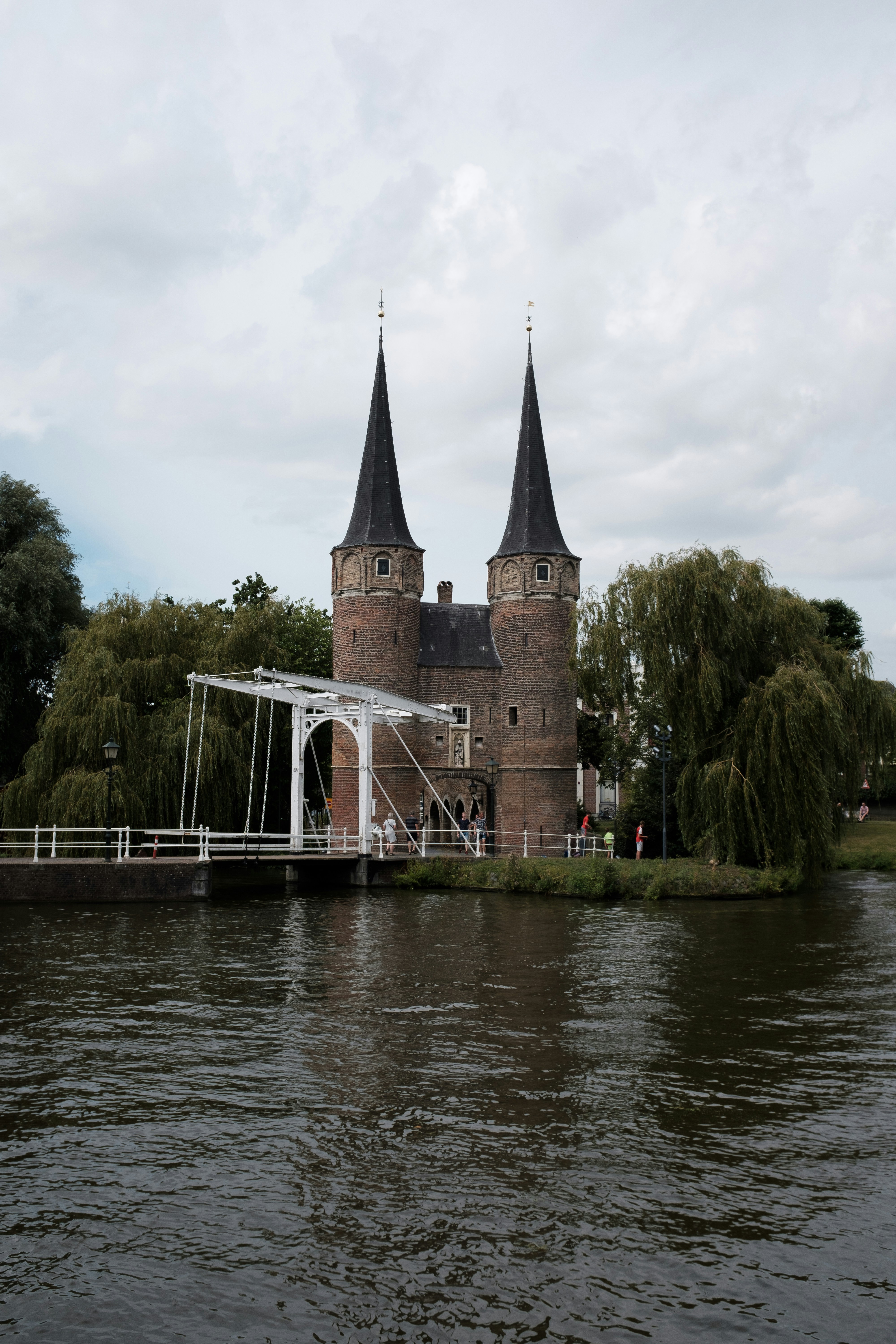 brown concrete building near body of water during daytime