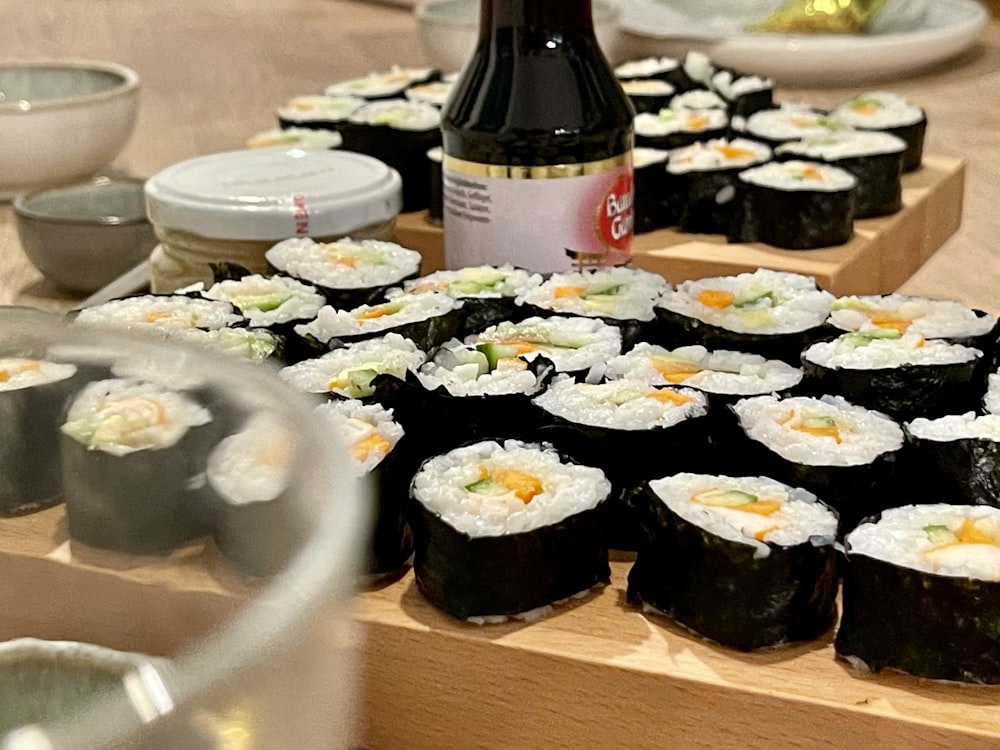 white and black labeled bottle on brown wooden table