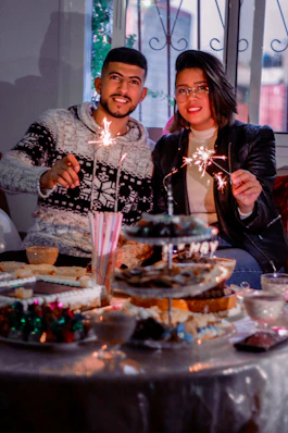 woman in black long sleeve shirt holding cake
