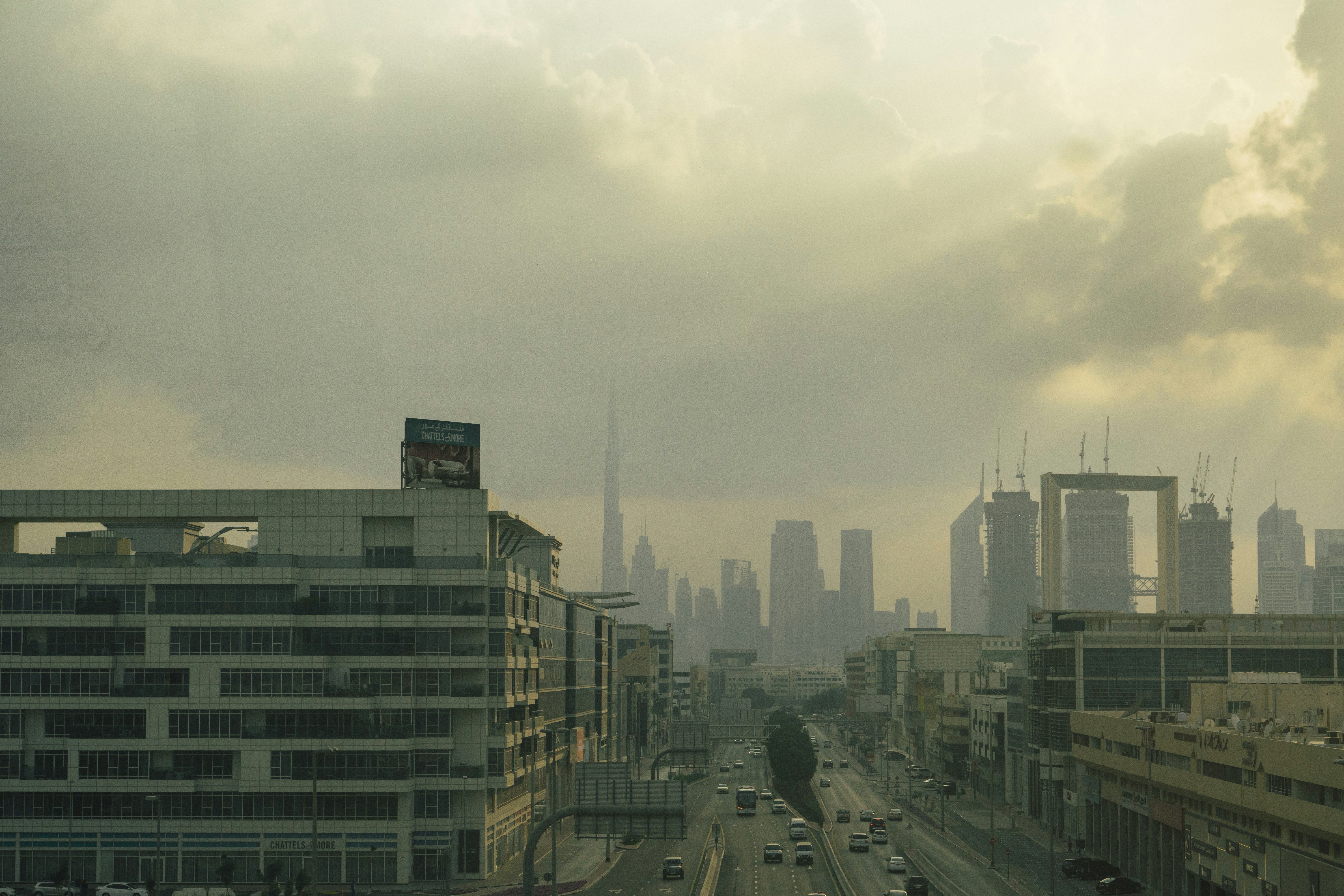 city buildings under white clouds during daytime