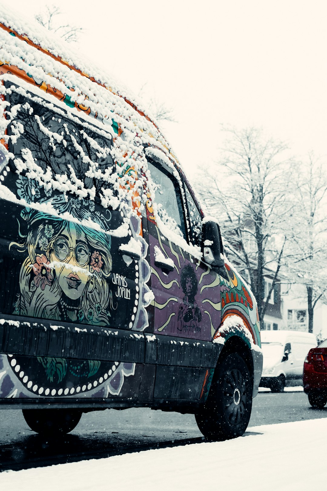 brown and green van on snow covered road during daytime