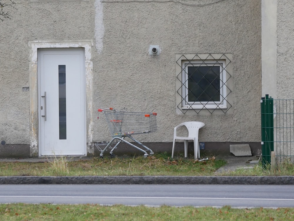 white wooden door on gray concrete wall