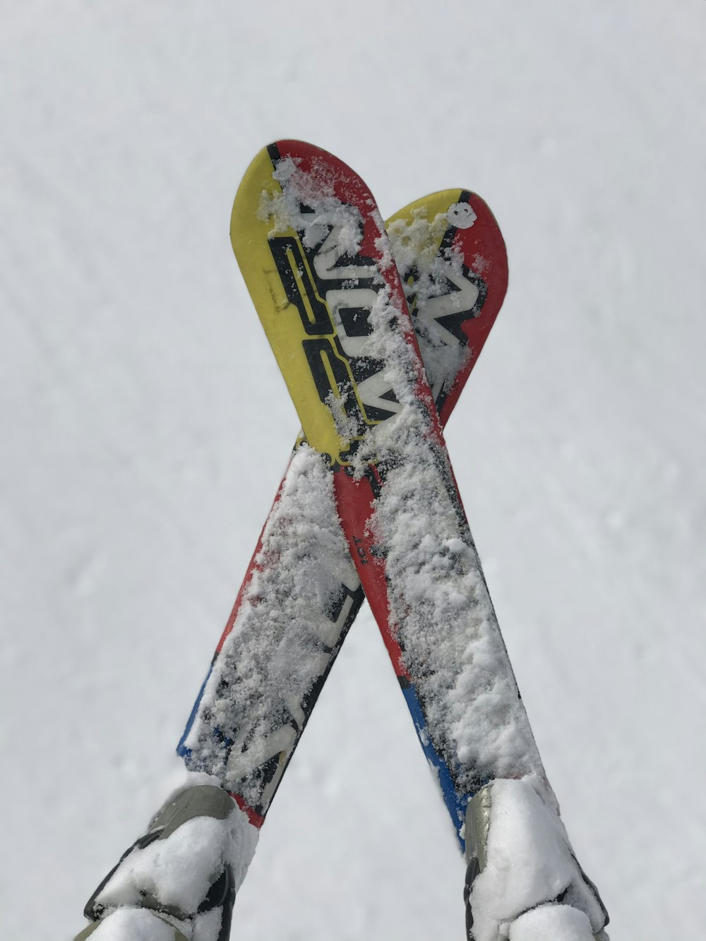 red and yellow snow ski