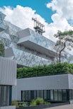 white concrete building near green trees during daytime