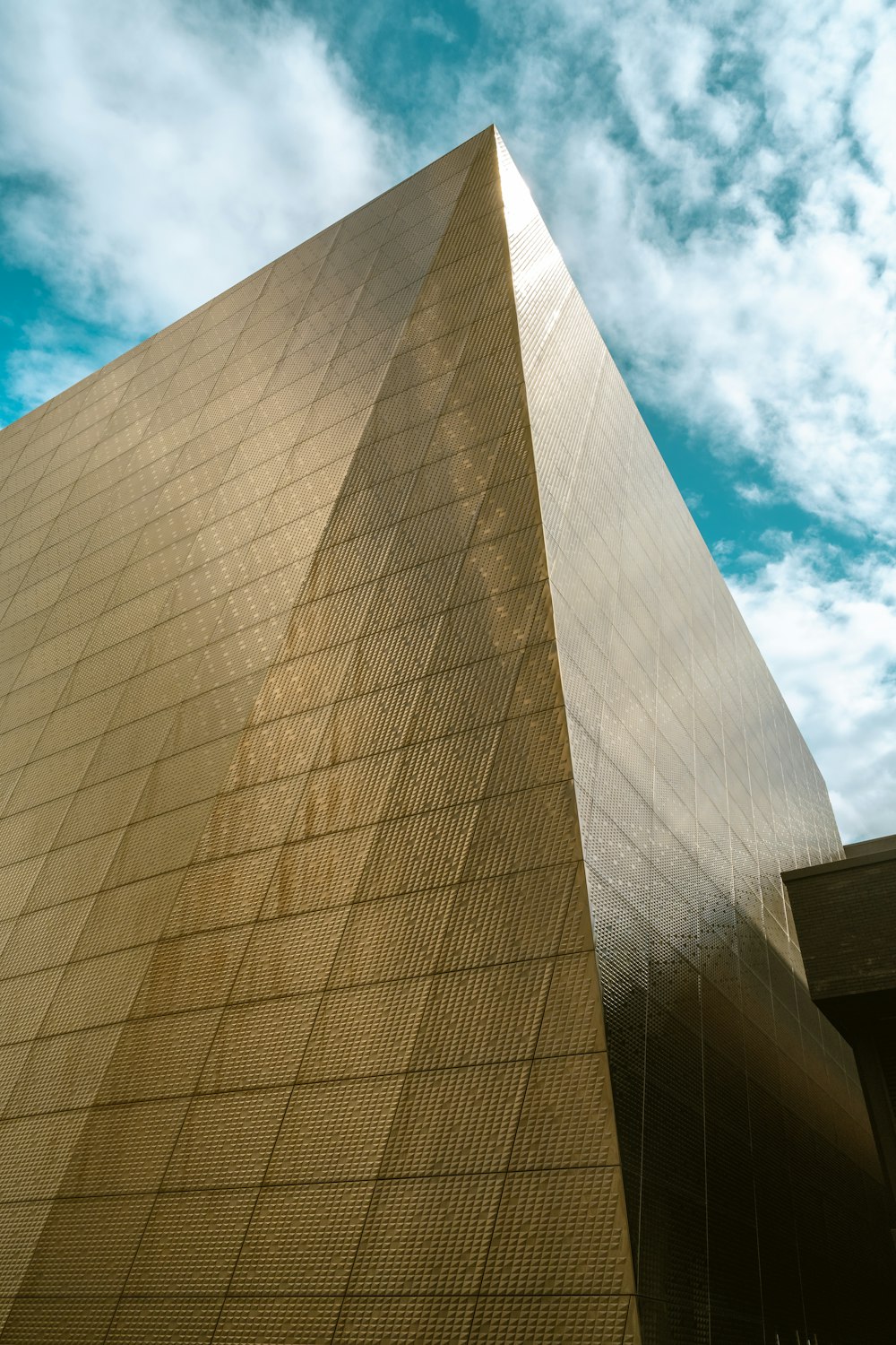 brown concrete building under blue sky during daytime