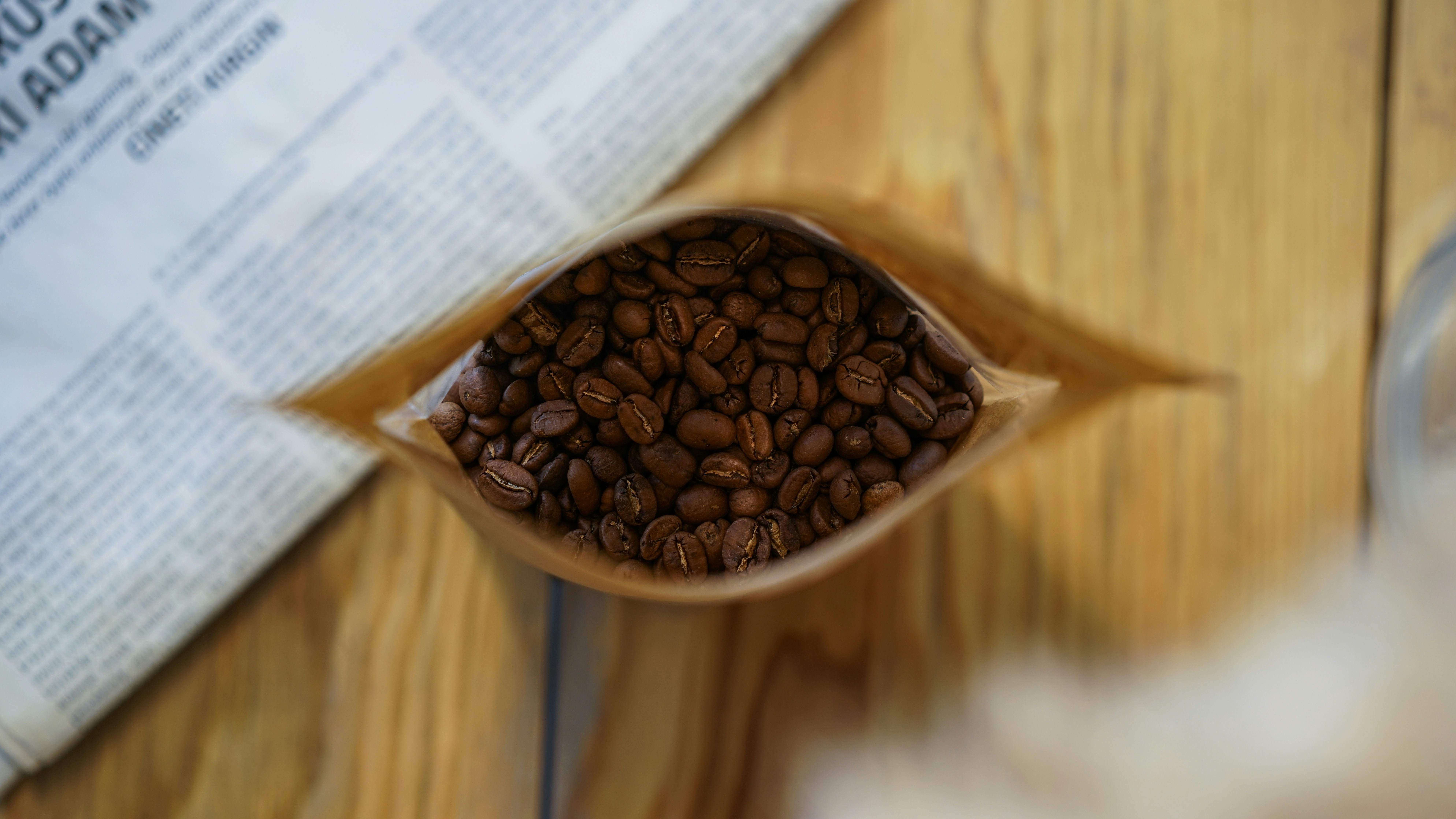 brown coffee beans on brown wooden table