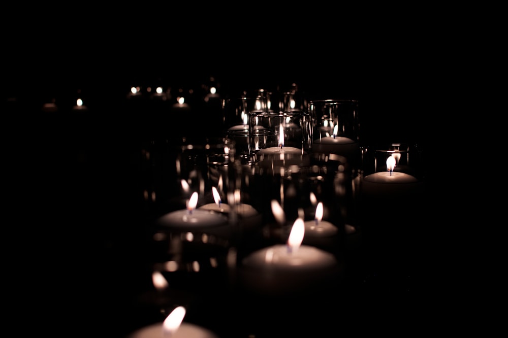 lighted candles on black surface