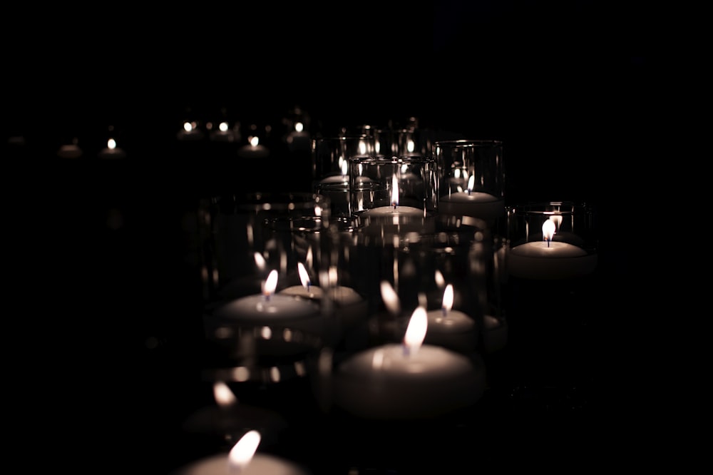 lighted candles on black surface