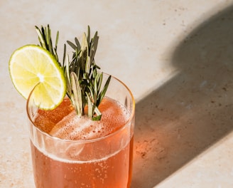 clear drinking glass with orange juice