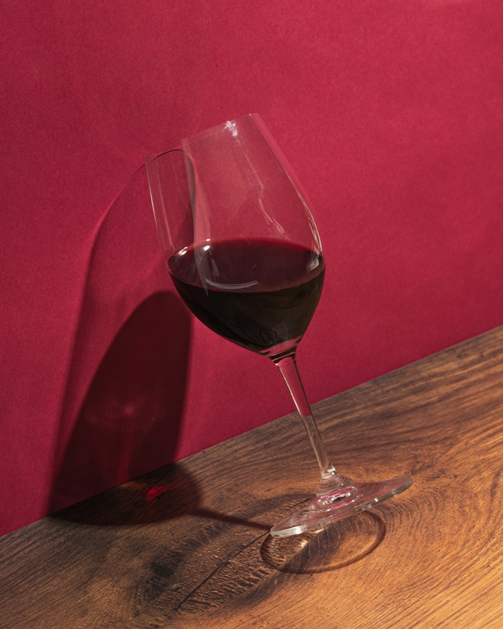 clear wine glass on brown wooden table