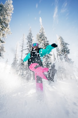 Snowboarder kicking up a spray of powder at Winter Park