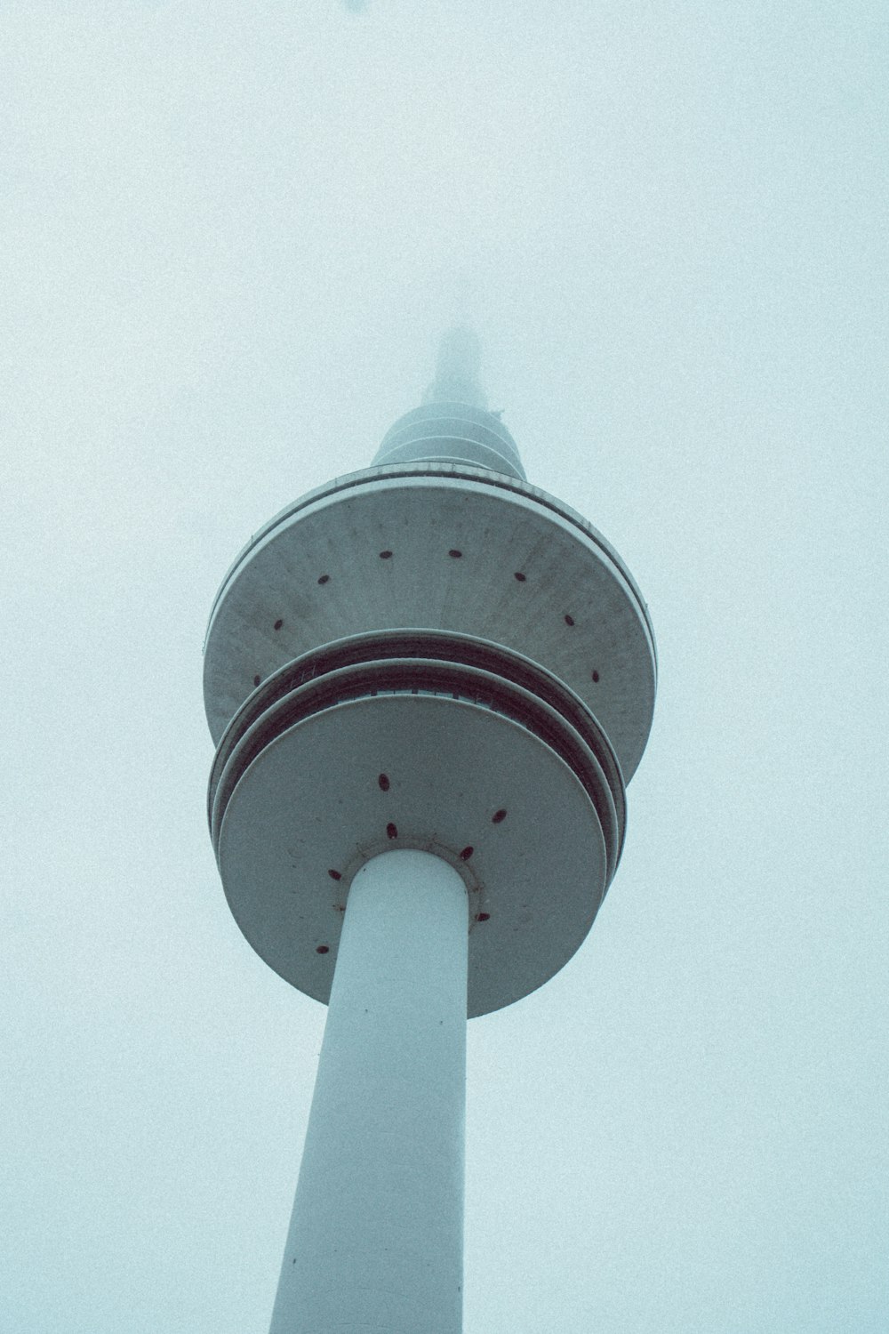 white and red tower under blue sky during daytime