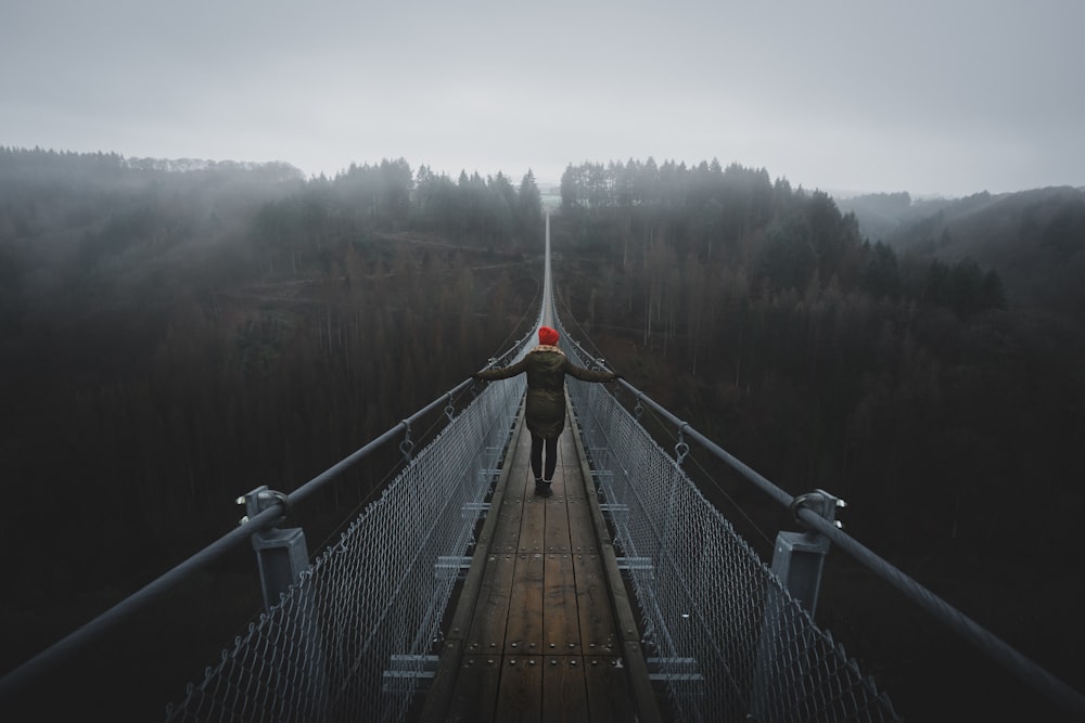 brown wooden bridge over the river