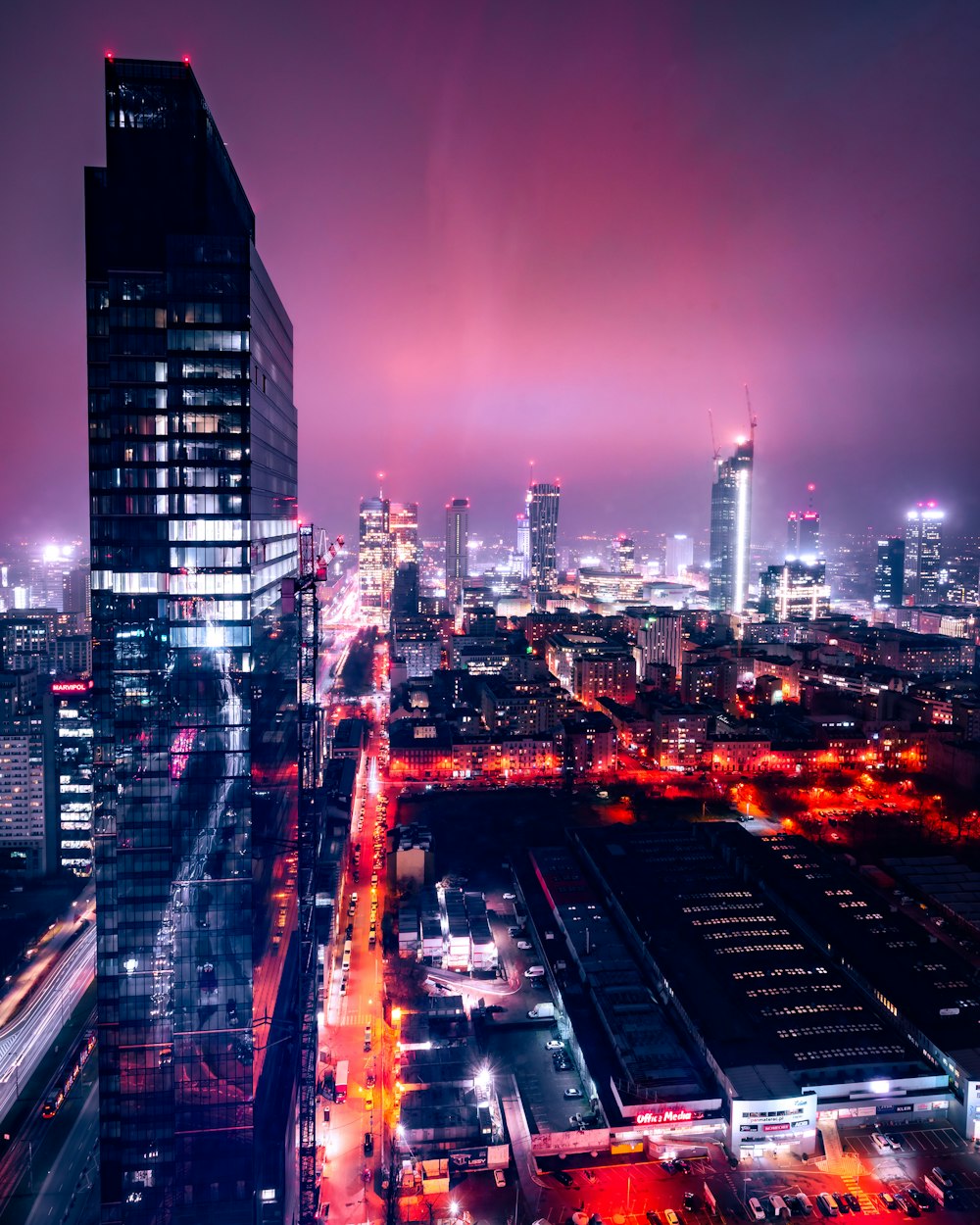 city with high rise buildings during night time